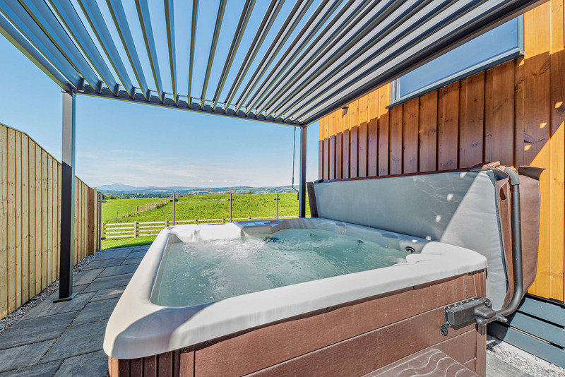 Hot tub with partial cover at Glencoe Executive